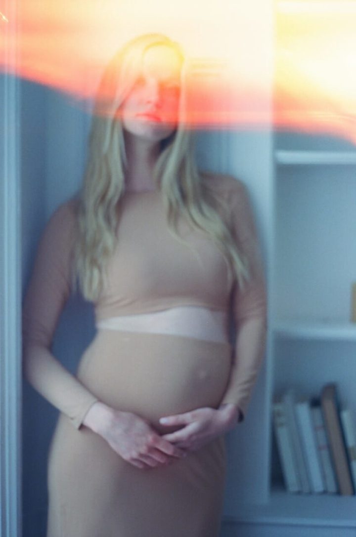 pregnant woman in 2 piece on film