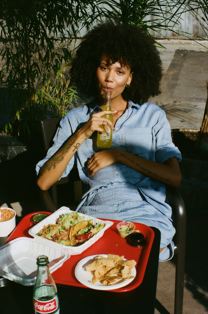pregnant woman eating tacos