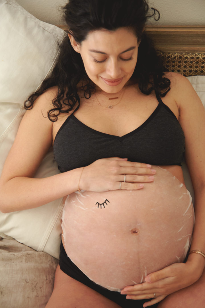 pregnant woman with belly mask