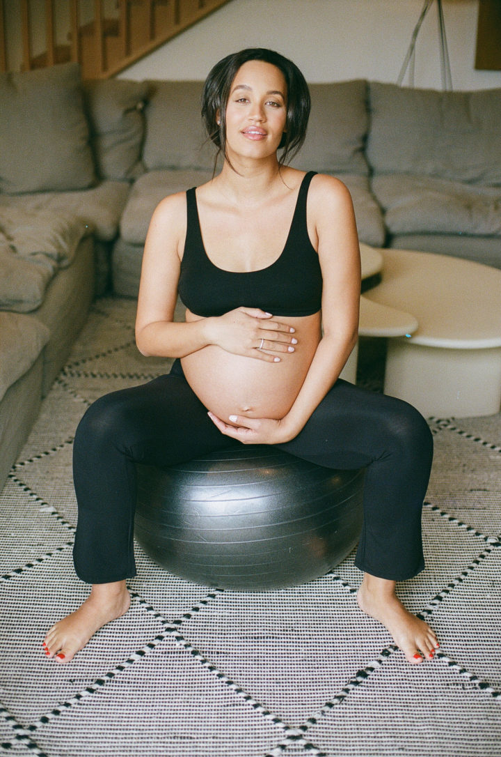 pregnant woman sitting on yoga ball