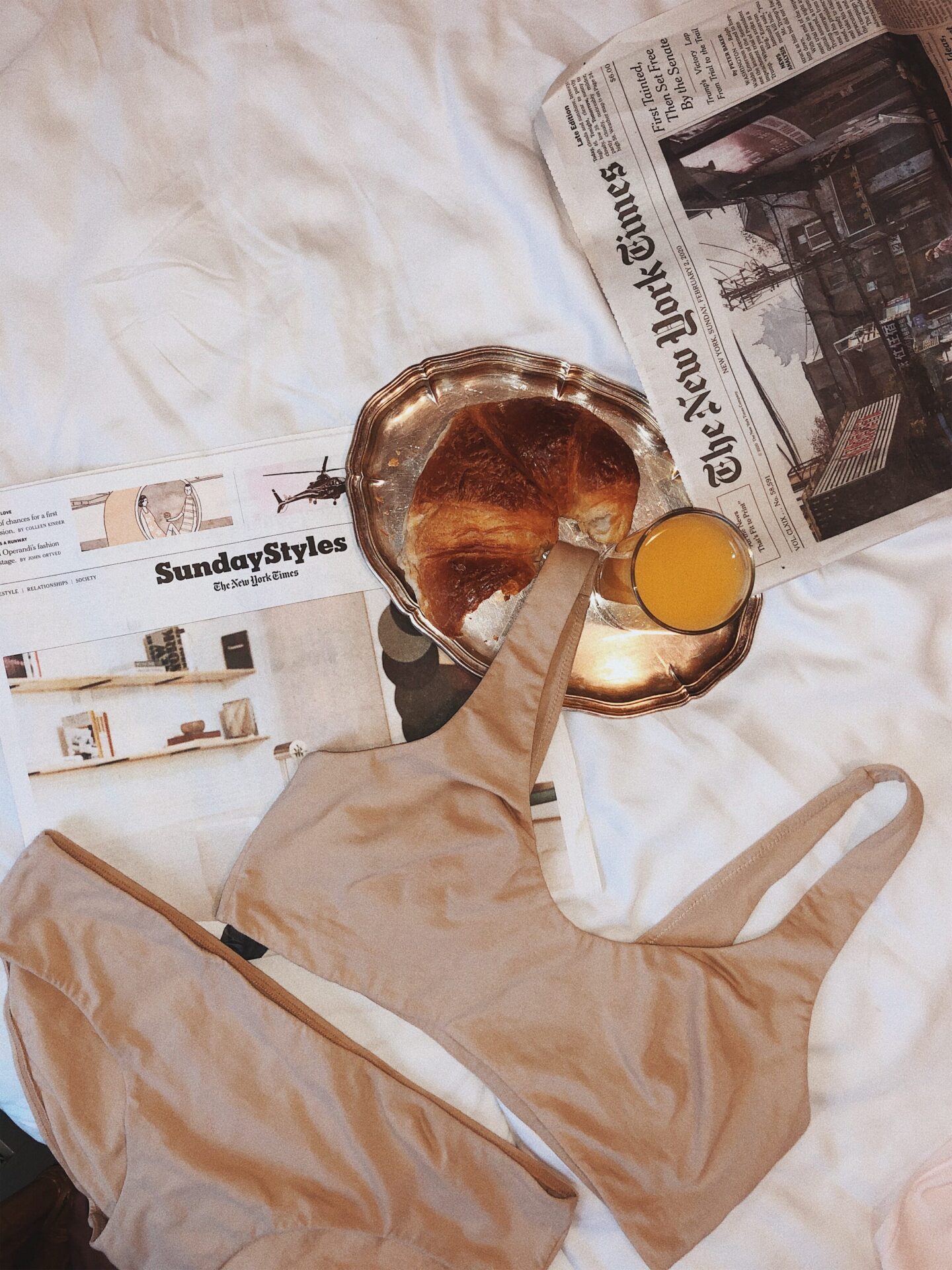 bra and underwear with a newspaper and breakfast