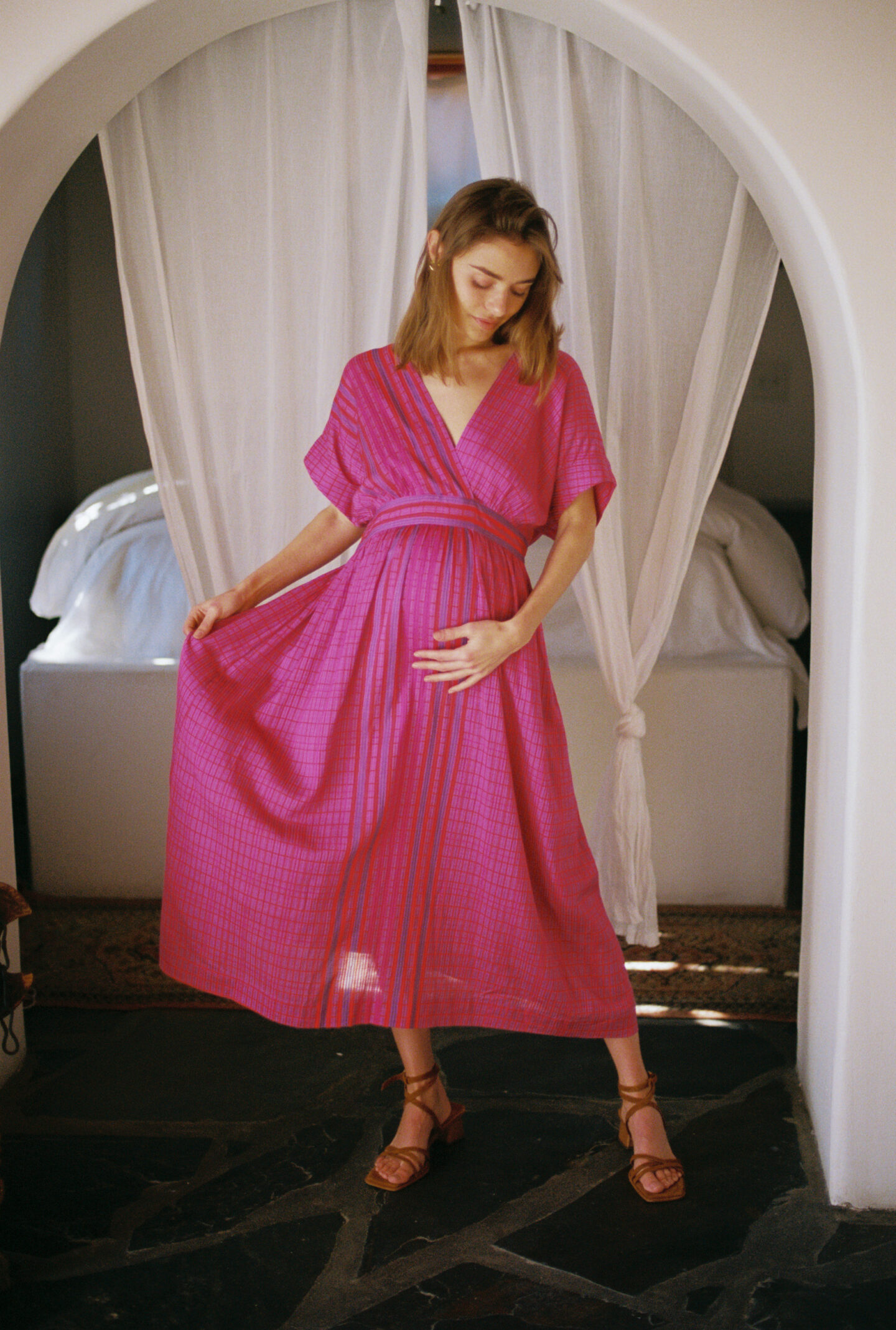 pregnant woman in a pink dress