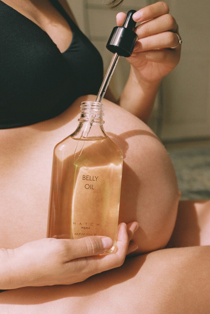 pregnant belly with hatch's belly oil