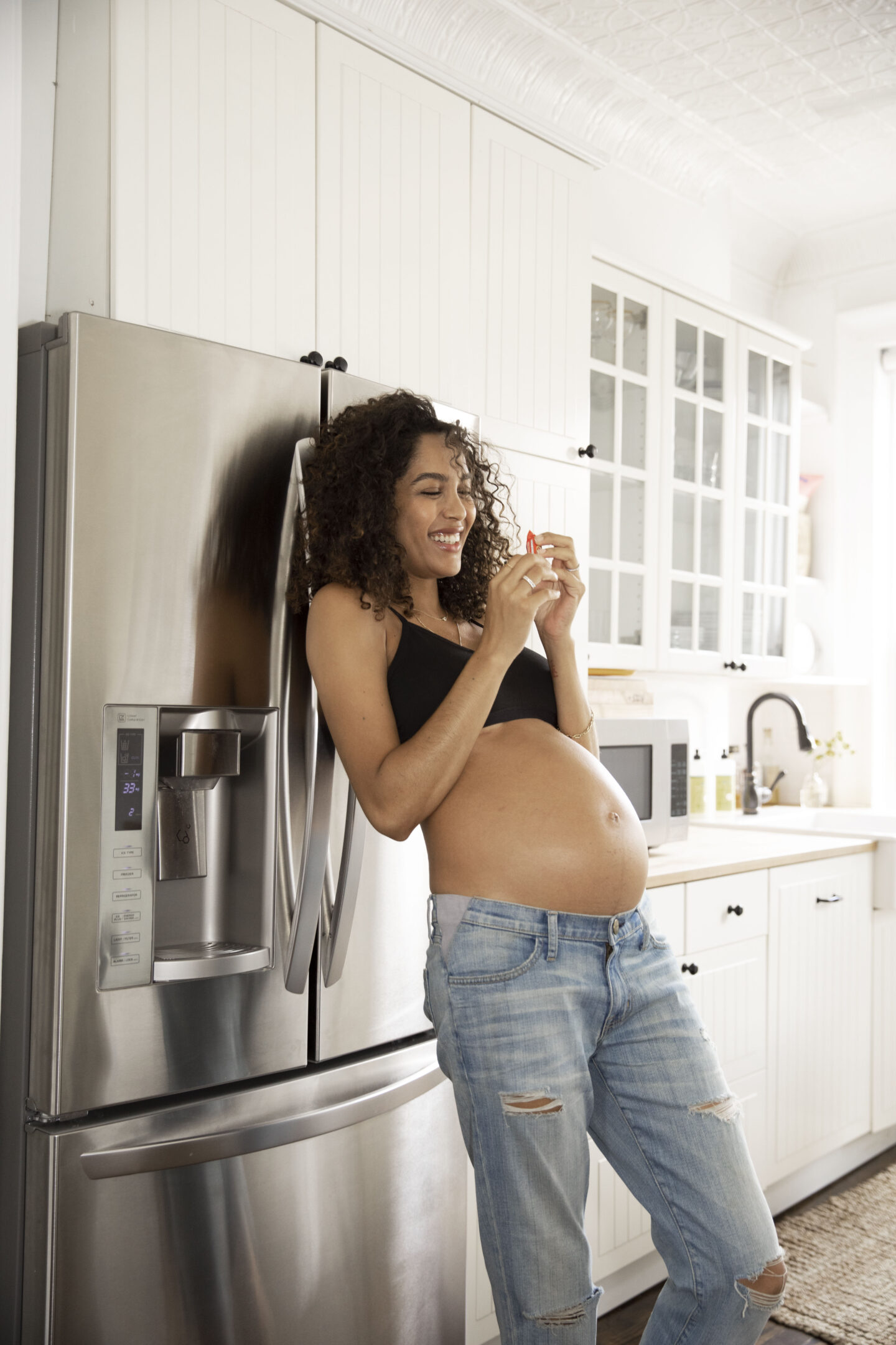 pregnant woman at her fridge