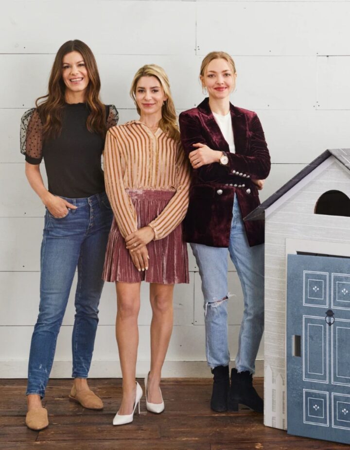 Amanda Seyfried and the founders of Make It Cute Kids standing next to the playhouse
