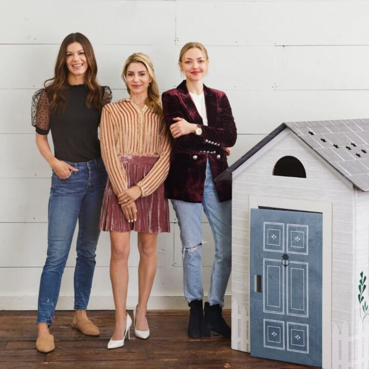 Amanda Seyfried and the founders of Make It Cute Kids standing next to the playhouse