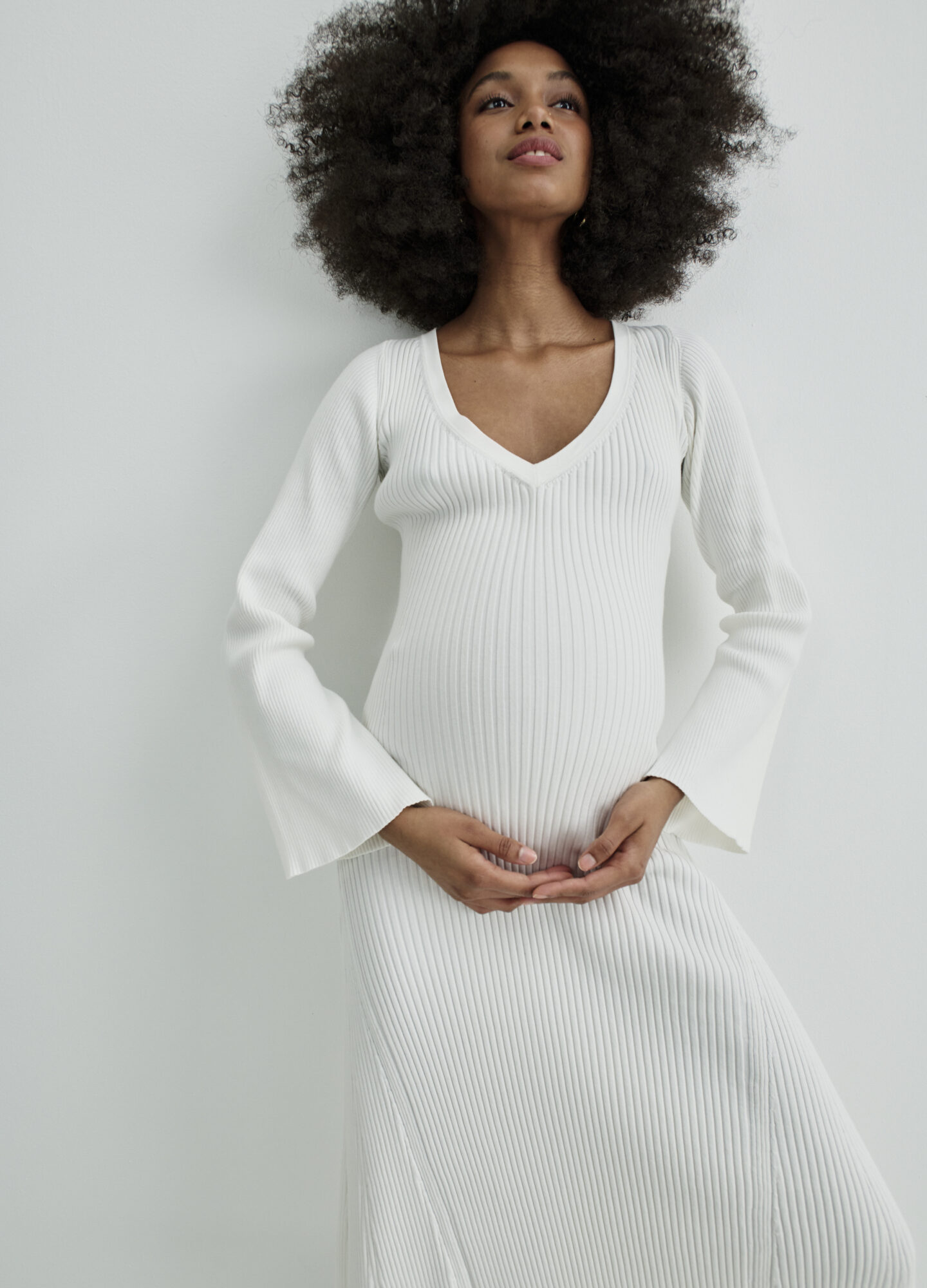 pregnant woman in white dress
