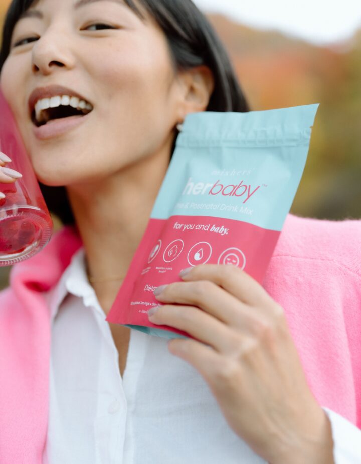 Woman holding Mixhers product.